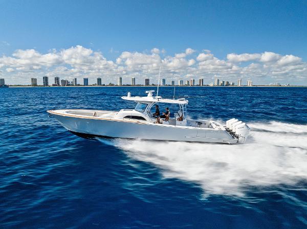 Valhalla Boatworks V-46 2021 Valhalla Boatworks V-46 cruising on open ocean with city skyline in background.
