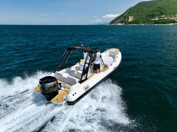 Aqvaboats Luxrib 22 Aqvaboats Luxrib 22 (2025) cruising on open water near a scenic coastline.