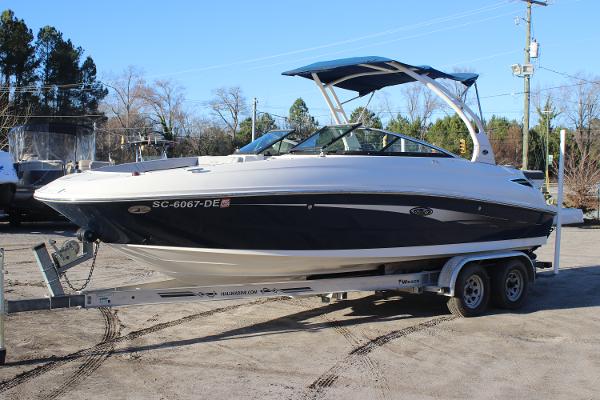 Sea Ray 240 Sundeck 2016 Sea Ray 240 Sundeck boat on trailer, parked outdoors.