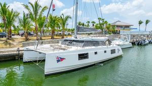 Nautitech 46 Open 2021 Nautitech 46 Open catamaran docked in a tropical marina.