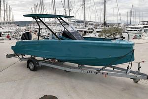 Axopar Axopar 22 T-Top 2022 Axopar 22 T-Top boat on trailer at marina, surrounded by yachts.