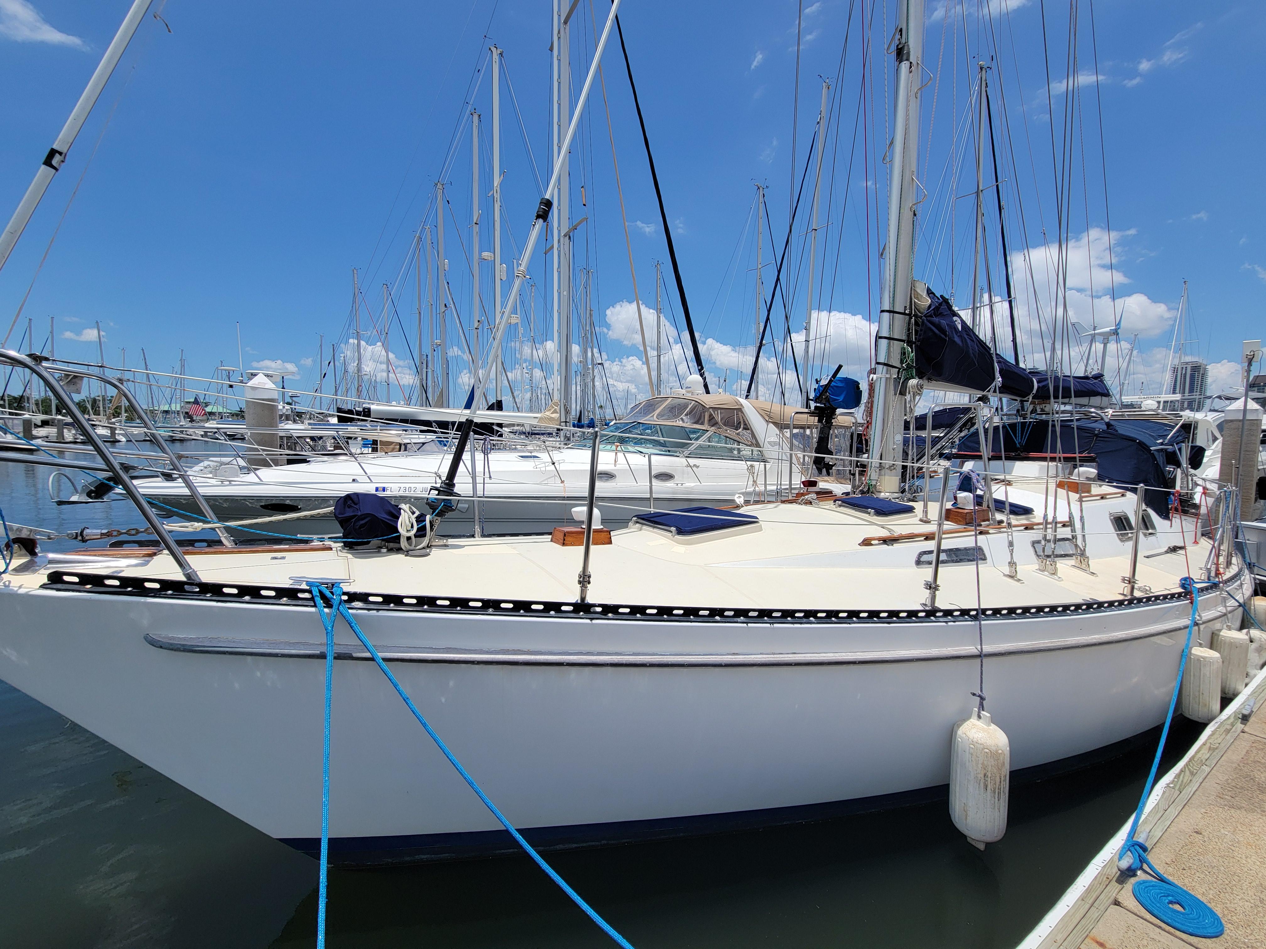 Tayana Vancouver 42 1981 Tayana Vancouver 42 sailboat docked at marina under clear blue sky.