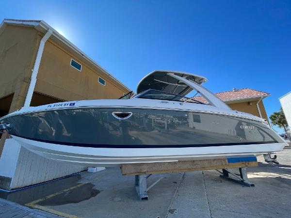 Cobalt 30SC Outboard 2021 Cobalt 30SC Outboard boat on display, sleek design, gray and white exterior.