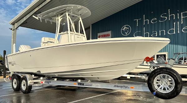 Pathfinder 2400 Open 2025 Pathfinder 2400 Open boat on trailer at dealership.