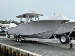 Tidewater 380 CC Adventure 2025 Tidewater 380 CC Adventure boat on trailer at marina.