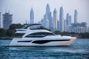 Princess Model 2022 Luxury Princess Model 2022 yacht cruising with city skyline backdrop.
