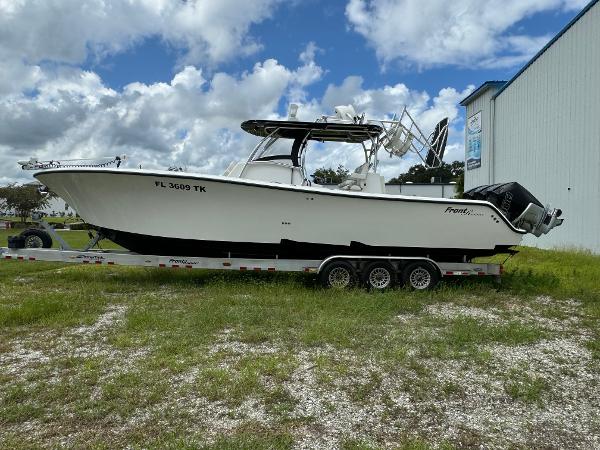 Front Runner 36 Center Console 2023 Front Runner 36 Center Console boat on trailer, parked outdoors.