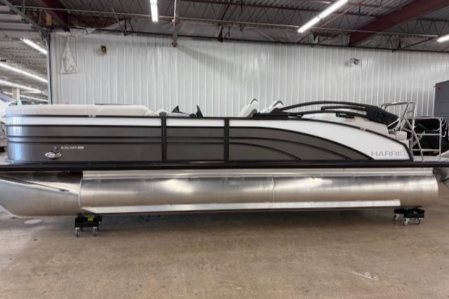 Harris Sunliner 230 2025 Harris Sunliner 230 pontoon boat in a showroom, side view.
