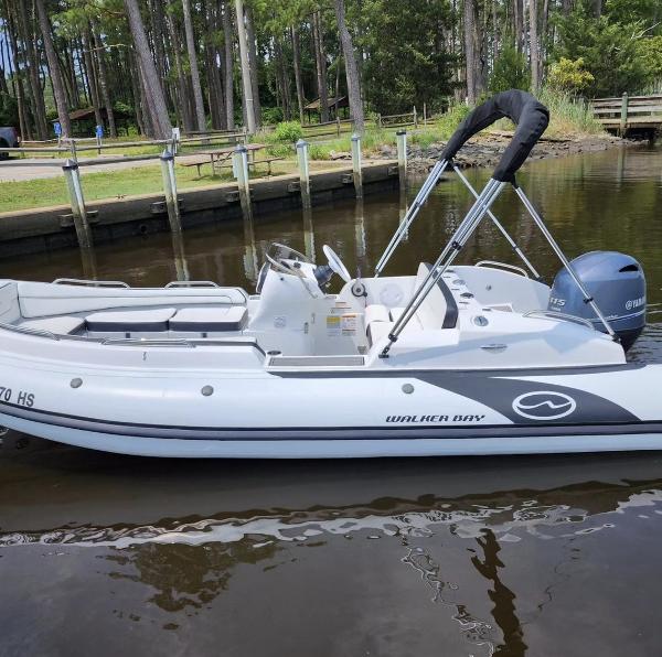 Walker Bay Generation 525 2025 Walker Bay Generation 525 boat docked in a serene lakeside setting.