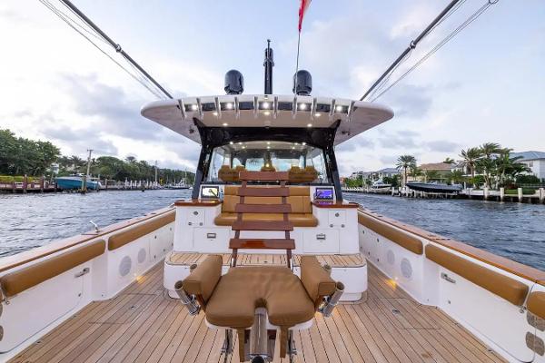HCB Estrella 2020 HCB Estrella luxury boat with spacious deck and seating, cruising on a scenic waterway.