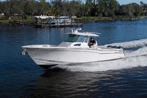 Grady-White Canyon 376 2018 Grady-White Canyon 376 boat cruising on a serene river.