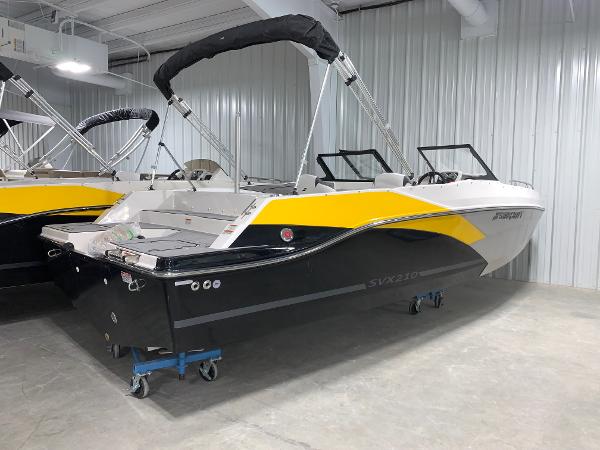 Starcraft SVX 210 2024 Starcraft SVX 210 boat in showroom, black and yellow exterior.