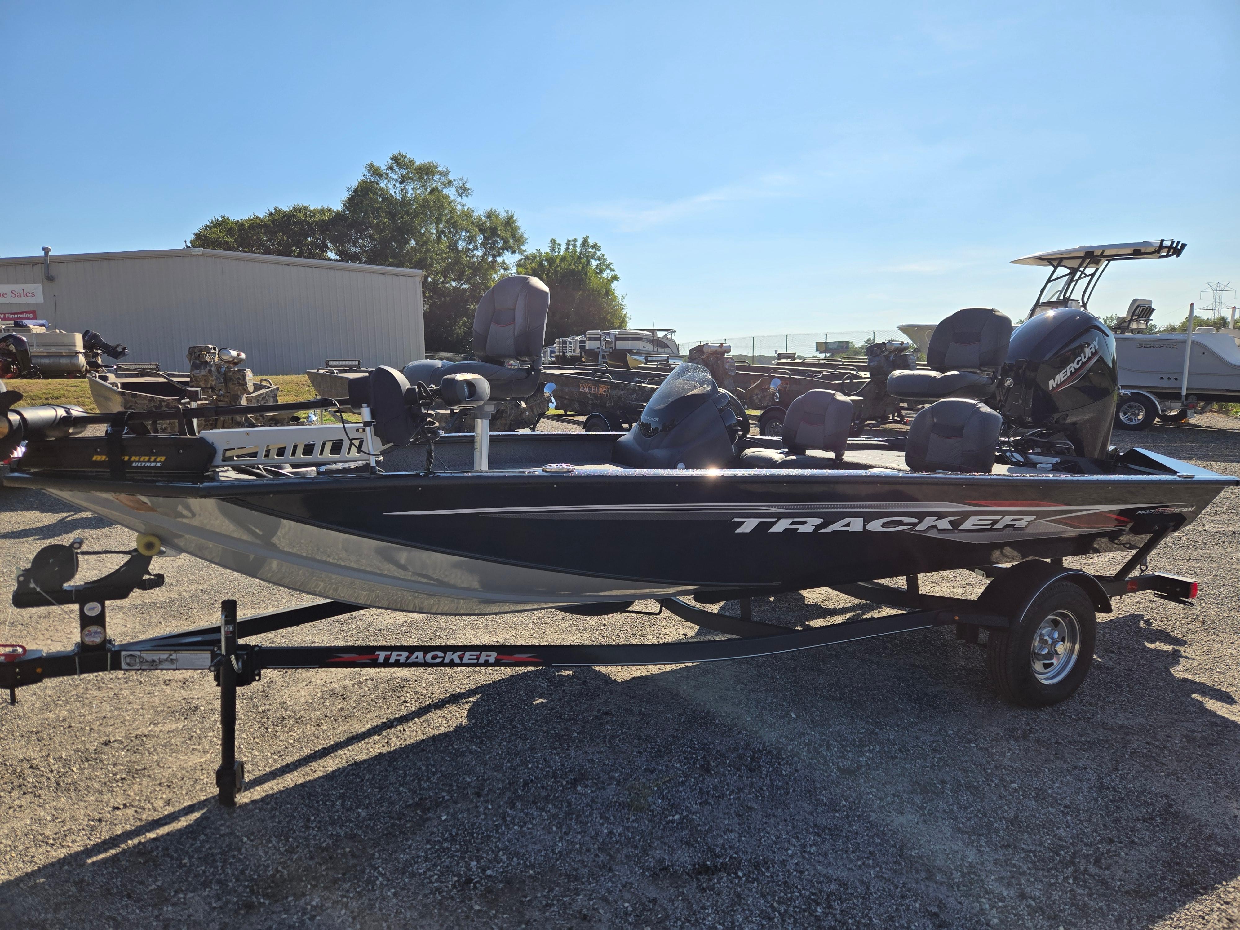 Tracker Pro Team 175 TF 2023 Tracker Pro Team 175 TF fishing boat on trailer, parked outdoors.