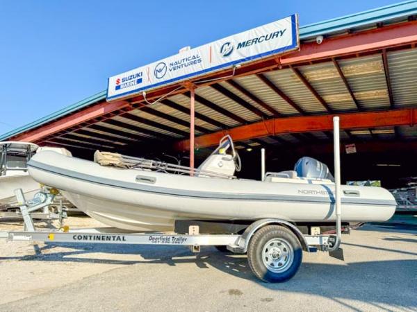 Northstar Axis 4.8 RIB 2023 Northstar Axis 4.8 RIB boat on trailer outside dealership.