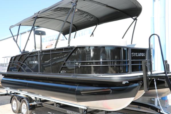 Sylvan Mirage X3 CLZ DH 2025 Sylvan Mirage X3 CLZ DH pontoon boat with black exterior on trailer.