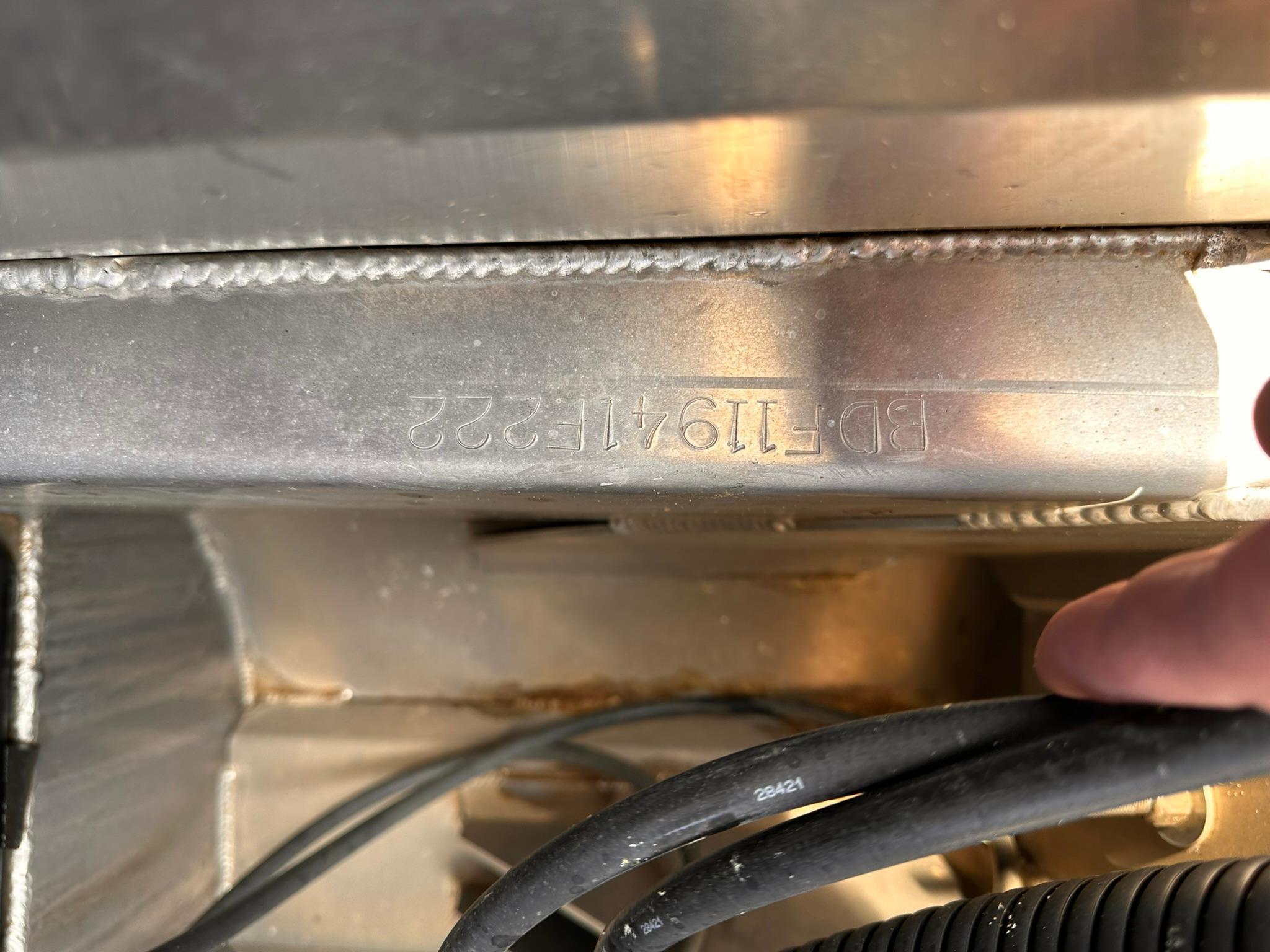 Barletta LUSSO 25U Close-up of Barletta LUSSO 25U 2022 model's metal component with engraved serial number.