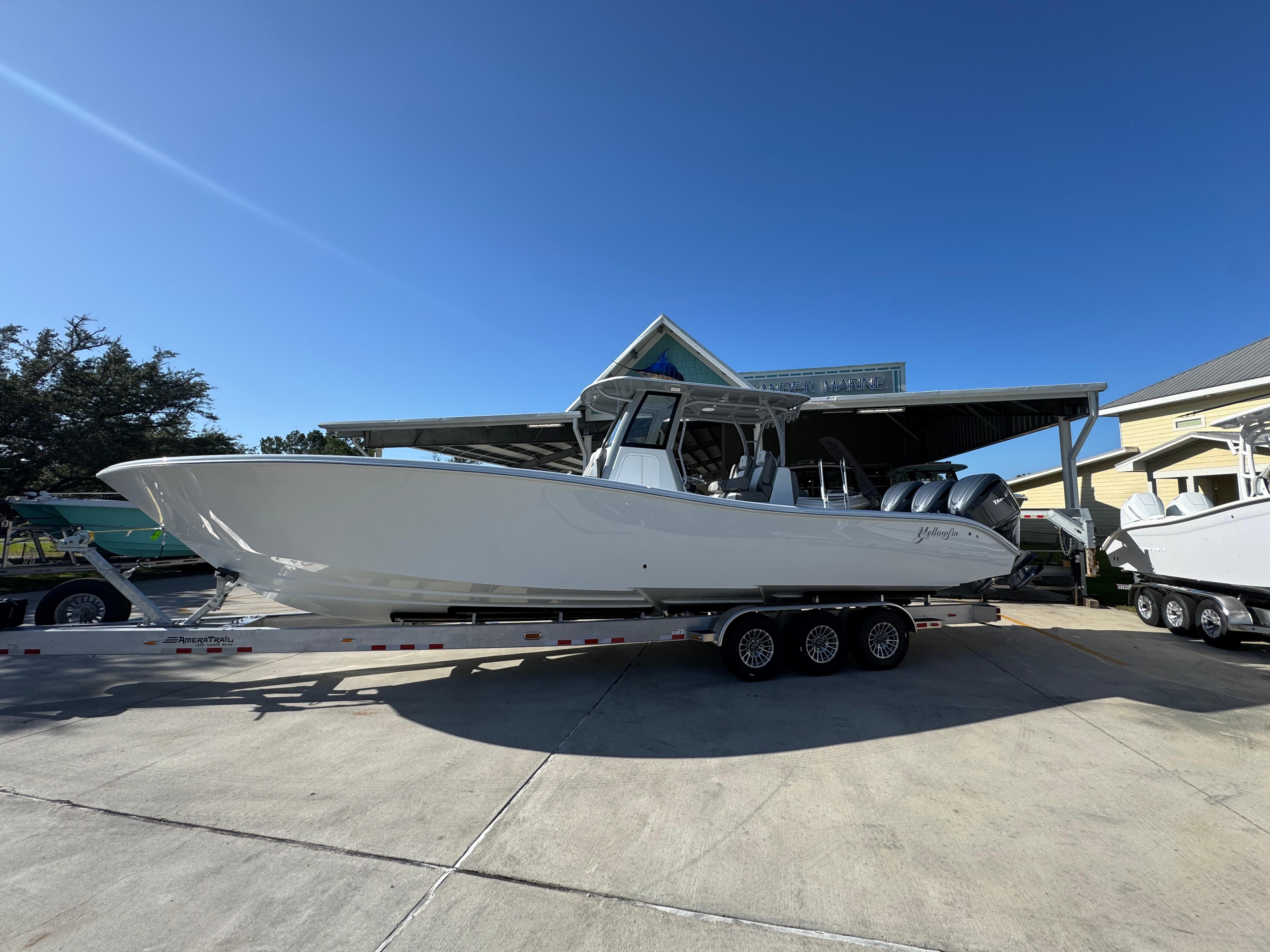 Yellowfin 36 Offshore 2026 Yellowfin 36 Offshore boat on trailer under clear blue sky.