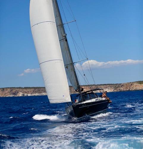 Grand Soleil 50 Sailing yacht Grand Soleil 50, 2009 model, navigating blue ocean waters under clear skies.