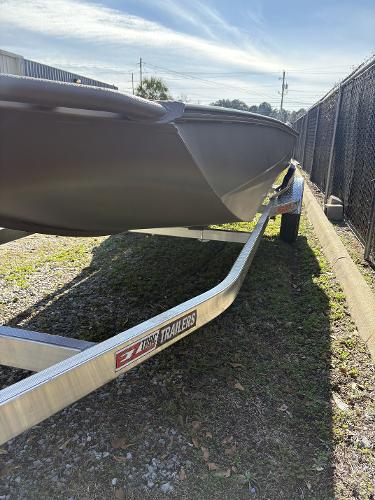 Edge Duck Boats 756db hpsd 2025 Edge Duck Boats 756db hpsd on EZ Loader trailer, parked outdoors.