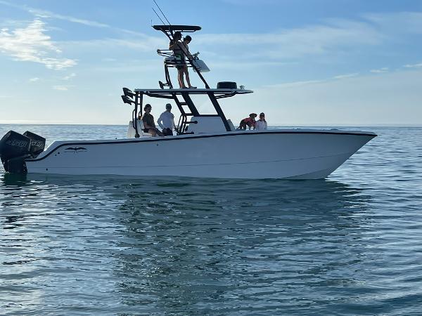 Invincible 33 Catamaran 2023 Invincible 33 Catamaran on calm water with passengers enjoying the ride.