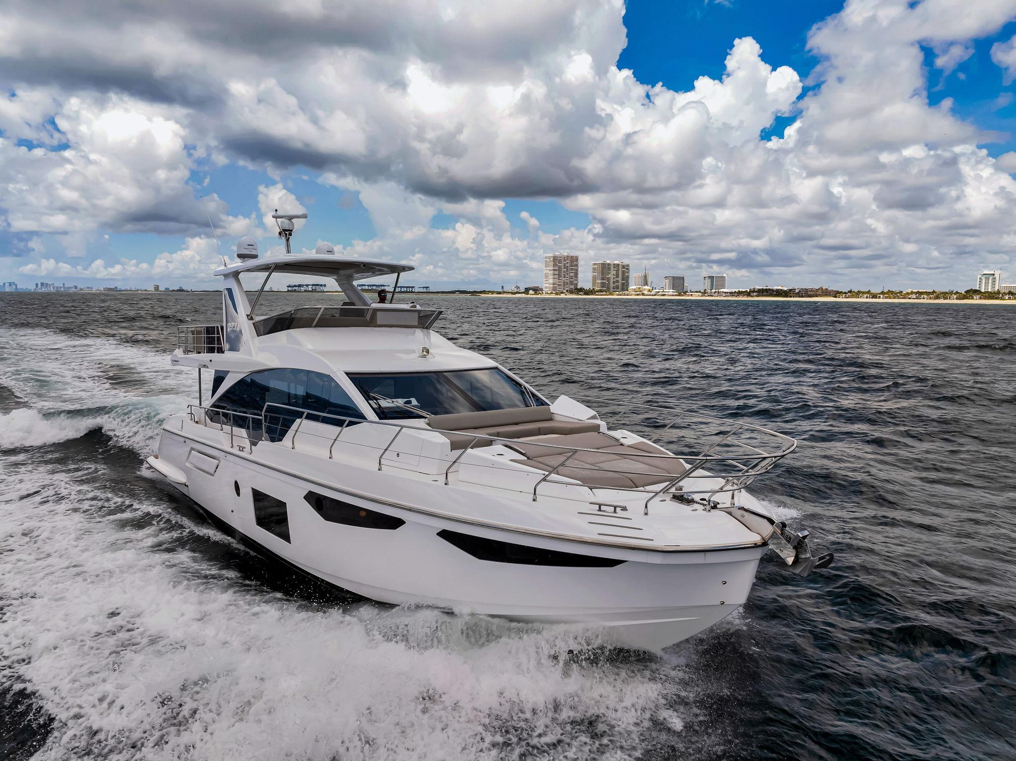 Azimut Fly 60 2022 Azimut Fly 60 yacht cruising on open water under a cloudy sky.