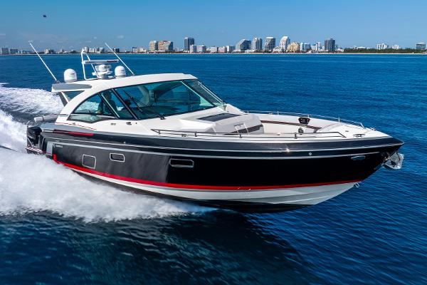 Formula 430 All Sport Crossover 2017 Formula 430 All Sport Crossover boat cruising on blue ocean near city skyline.