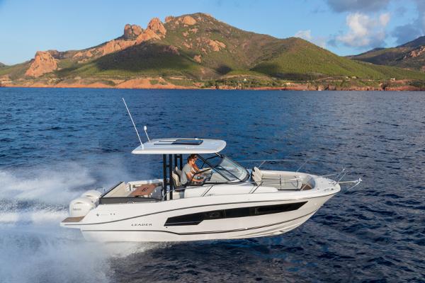 Jeanneau Leader 9.0 WA S2 2026 Jeanneau Leader 9.0 WA S2 cruising on ocean near scenic coastline.