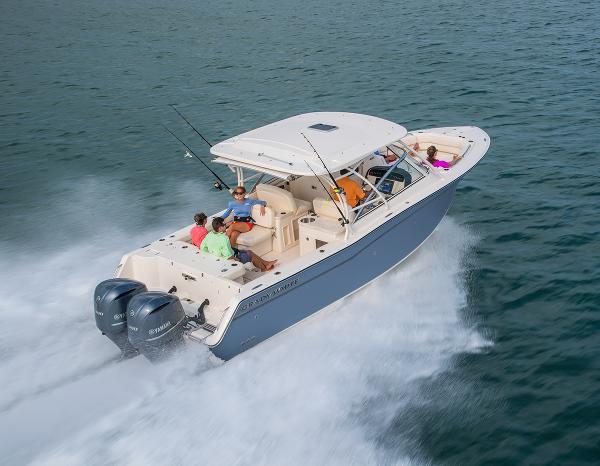 Grady-White 307 2024 Grady-White 307 boat cruising on water with passengers.