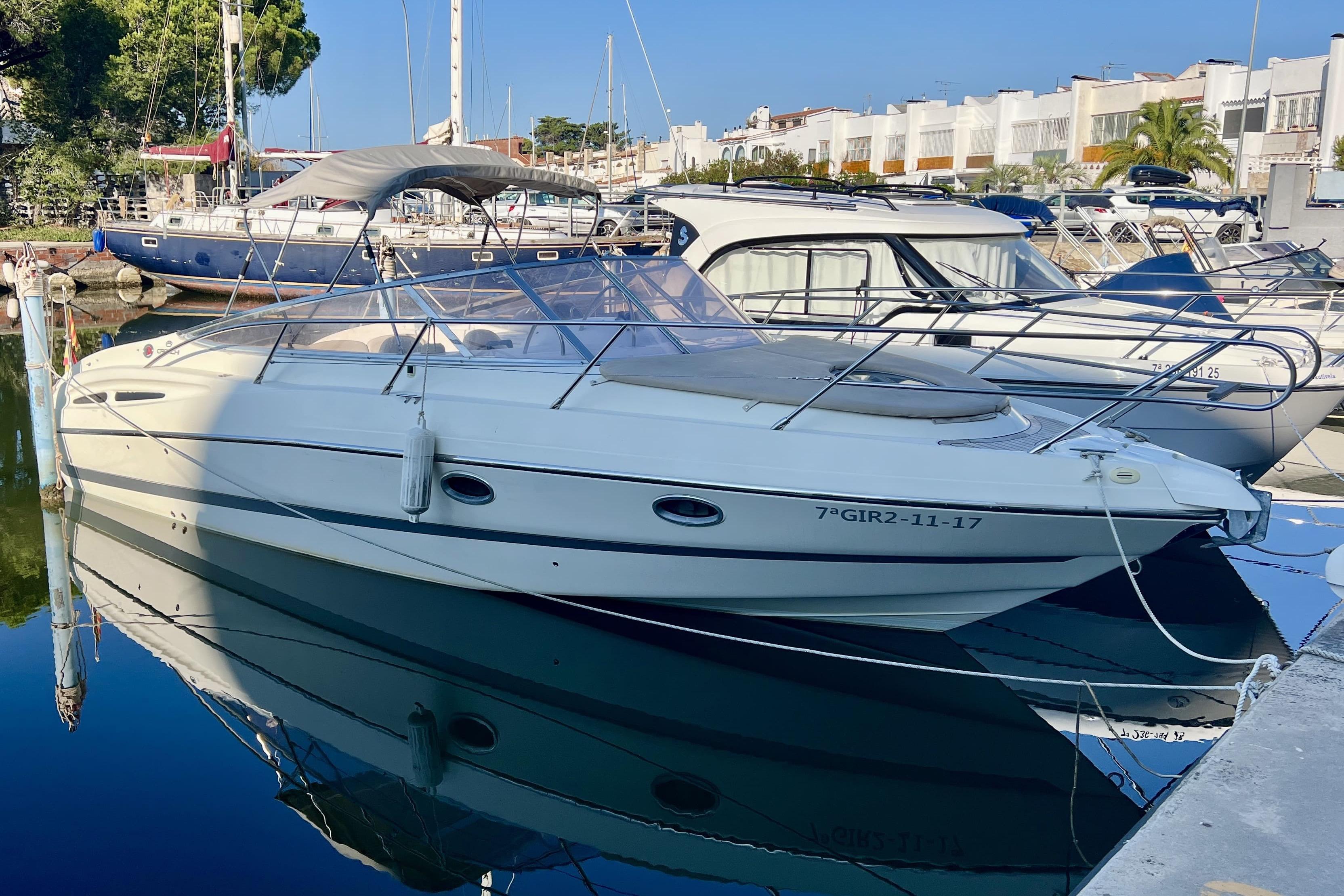 Cranchi CSL 28 2003 Cranchi CSL 28 yacht docked in a marina, reflecting on calm water.