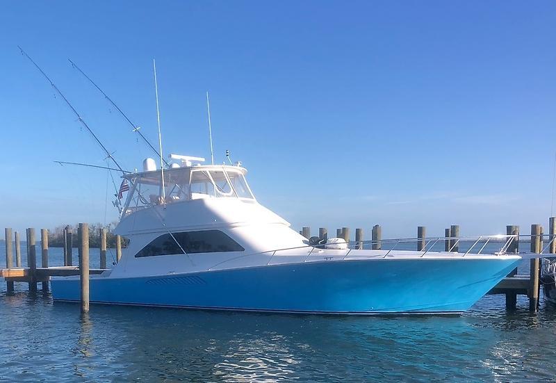 Viking 56 Convertible 2005 Viking 56 Convertible yacht docked in sunny marina.