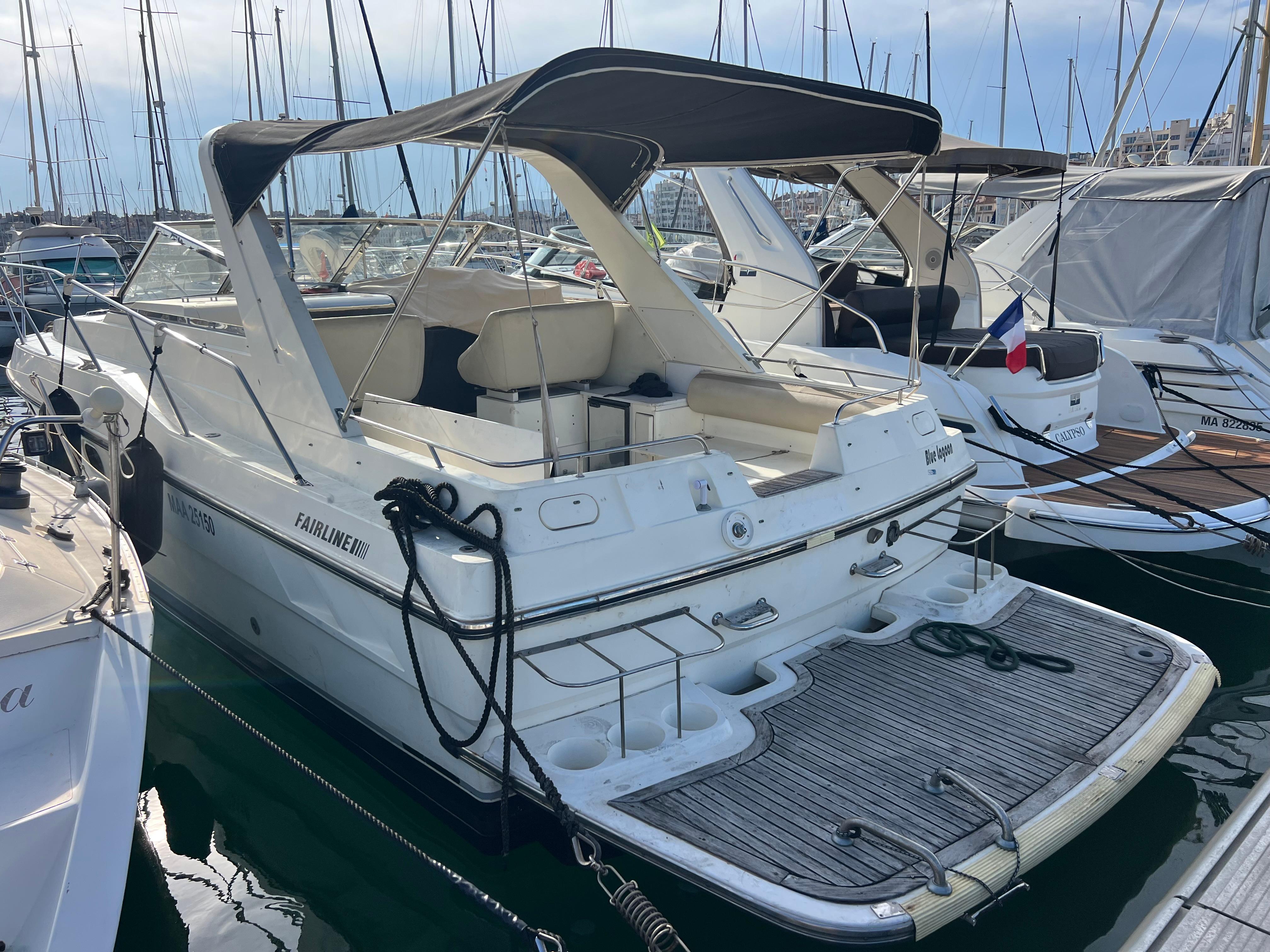 Fairline Targa 33 1990 Fairline Targa 33 yacht docked in marina, featuring spacious deck and canopy.