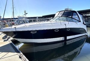 Chaparral Signature 350 2006 Chaparral Signature 350 boat docked in marina, sleek design, black and white exterior.