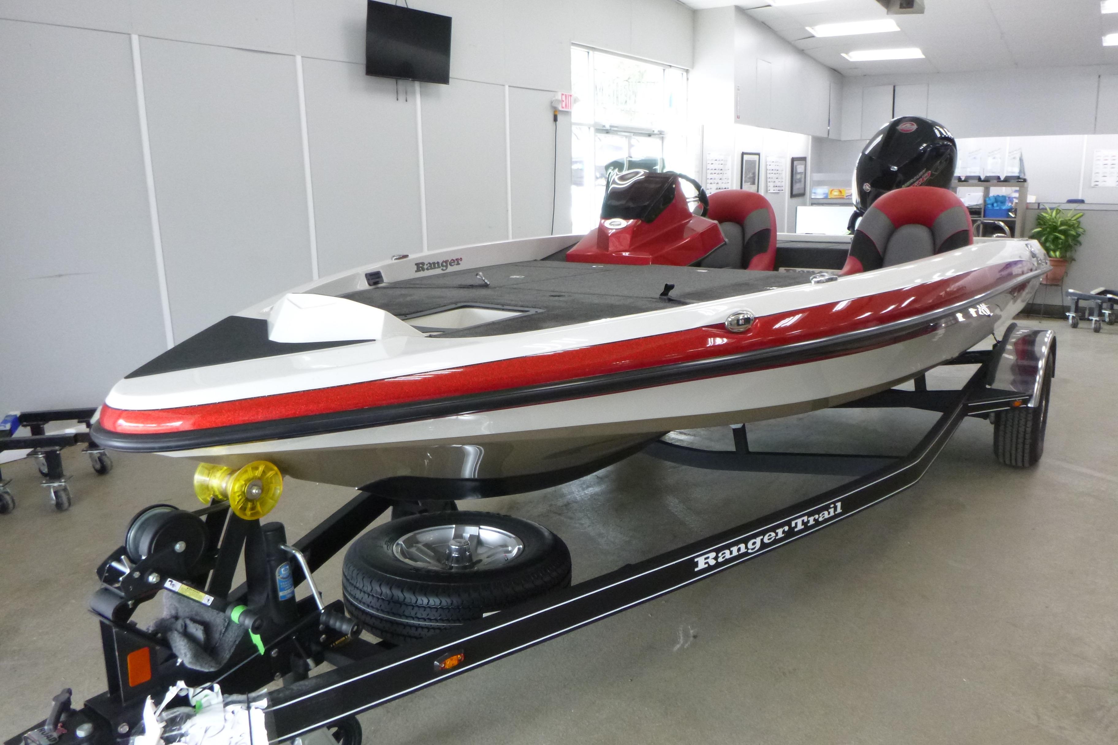 Ranger Z185 2025 Ranger Z185 boat on trailer in showroom, featuring sleek design and red accents.