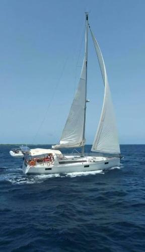Beneteau Oceanis 48 2014 Beneteau Oceanis 48 sailing on open sea under clear blue sky.
