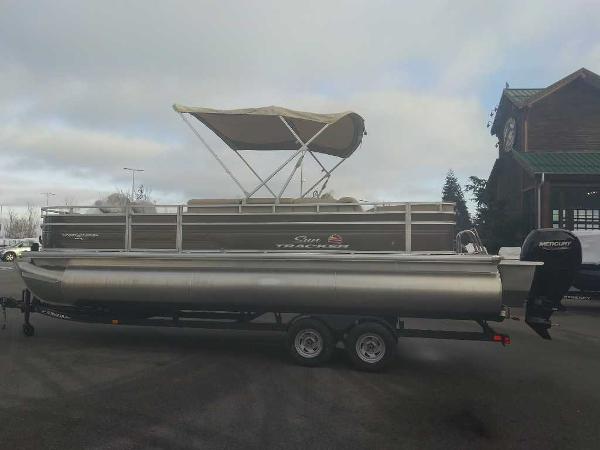 Sun Tracker Sportfish 24 XP3 2024 Sun Tracker Sportfish 24 XP3 pontoon boat on trailer with canopy.
