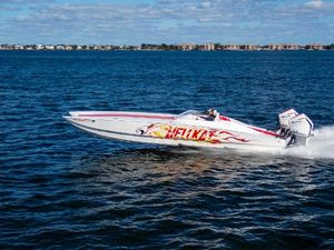 HellCat 32 Wide Body 2022 HellCat 32 Wide Body speedboat cruising on open water.