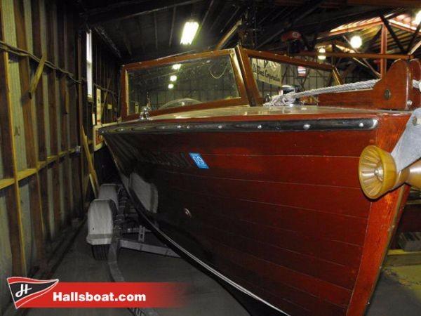 Hutchinson Utility 1950 Hutchinson Utility wooden boat in storage at Hallsboat.com.