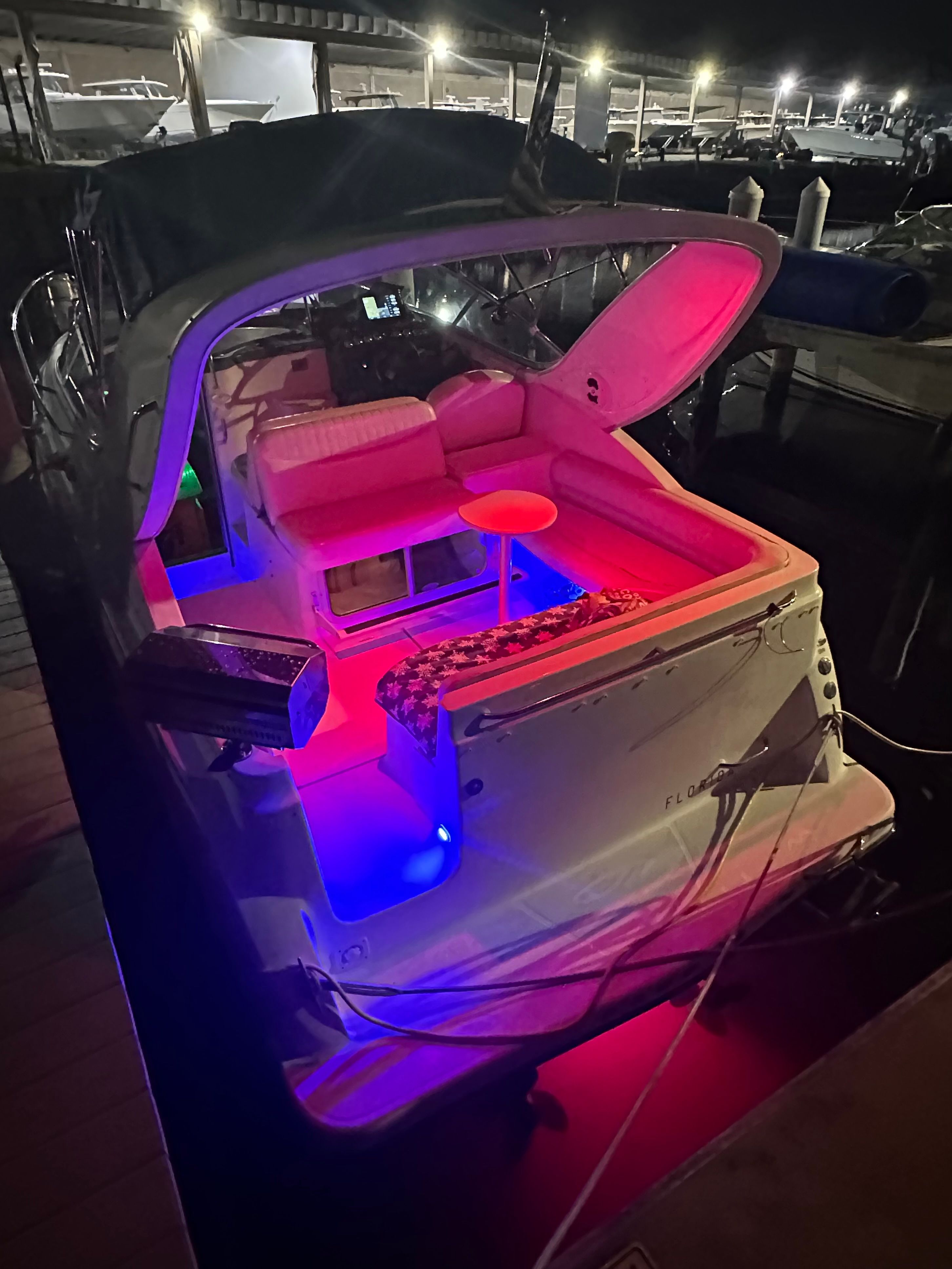Maxum 2900 SE 2005 Maxum 2900 SE boat with vibrant interior lighting at night.