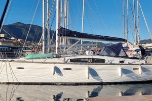 Beneteau Oceanis 43 2008 Beneteau Oceanis 43 sailboat docked in a marina with mountainous backdrop.