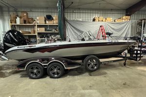 Ranger 621FS Fisherman 2018 Ranger 621FS Fisherman boat in a garage, on a trailer, with Mercury engine.