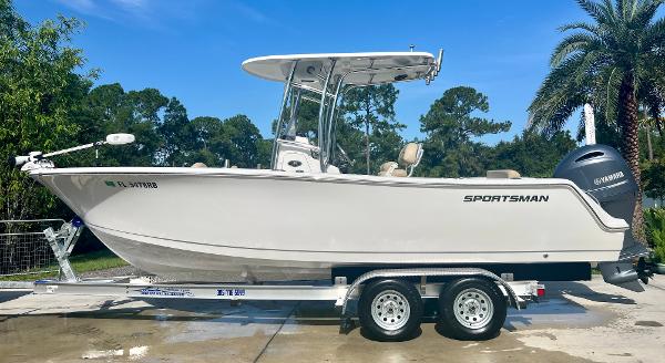 Sportsman 232 2015 Sportsman 232 boat on a trailer with Yamaha outboard motor.