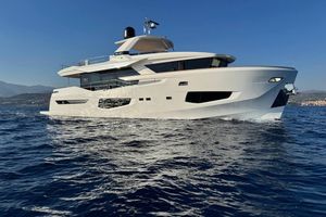 Numarine 26XP Luxury 2021 Numarine 26XP yacht cruising on open sea under clear blue sky.