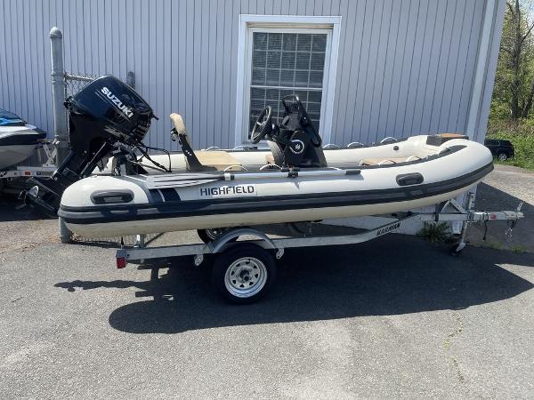 Highfield Classic 380 GT Limited 2023 Highfield Classic 380 GT Limited boat on trailer, featuring Suzuki outboard motor.