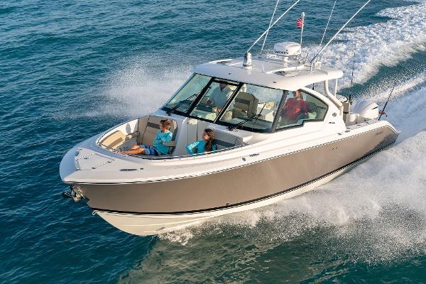 Pursuit DC 326 Dual Console 2025 Pursuit DC 326 boat cruising on open water.