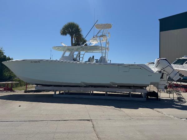 Invincible 46 Catamaran 2022 Invincible 46 Catamaran on display, side view, outdoors, clear sky.