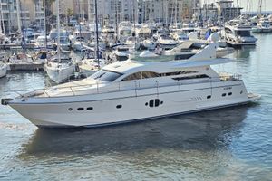 VZ 68 Luxury 2009 VZ 68 FLY yacht docked in a bustling marina.