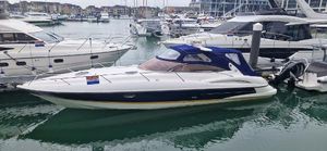 Sunseeker Superhawk 34 2003 Sunseeker Superhawk 34 yacht docked in a marina, surrounded by other boats.