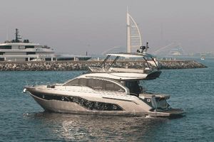 Cranchi E52 F Model 2021 Luxurious Cranchi E52 F yacht cruising near iconic Dubai skyline, 2021 model.