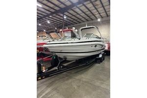 Crownline 280 SS 2024 Crownline 280 SS boat in a warehouse on a trailer.