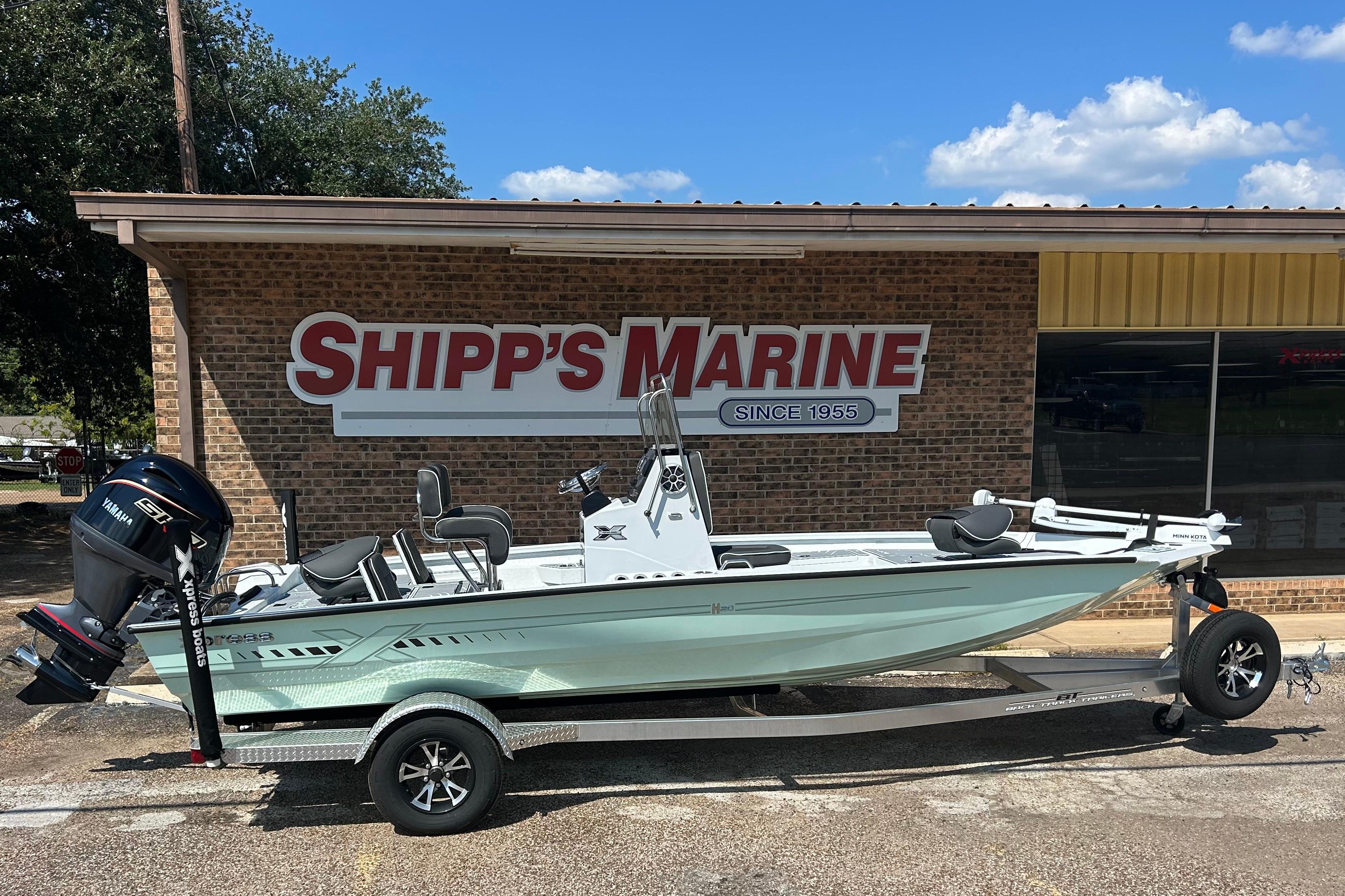 Xpress H20B Bay 2026 Xpress H20B Bay boat on trailer at Shipp's Marine dealership.
